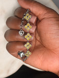 Gold floral/quatrefoil charm bracelet